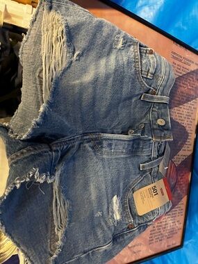 Levi's light blue denim jeans with tan stitching